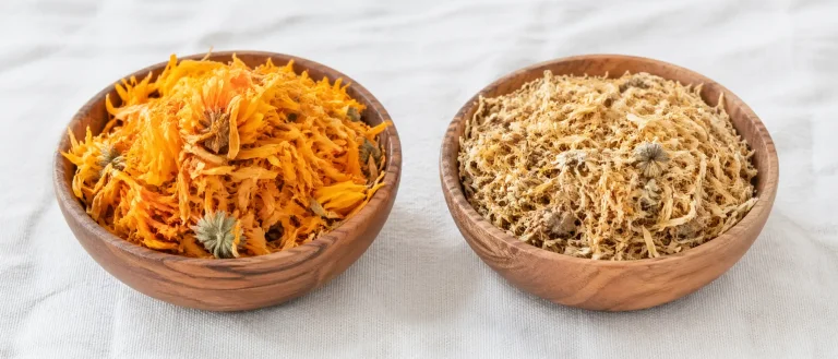 High-quality versus degraded dried calendula flowers showing color difference affordable organic herbs bulk